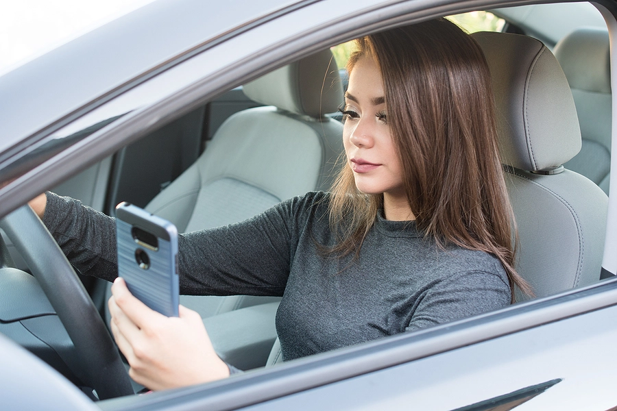 distracted female driver on her phone about to cause a Richfield car accident